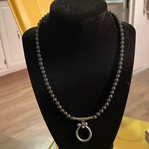 Hematite necklace with sterling silver pendant. Can be used to hold eyeglasses!